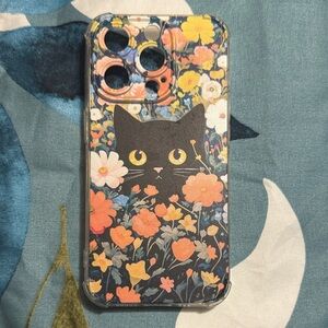 Used for one day, iPhone 15 pro cover. Black cat middle surrounded by flowers.
